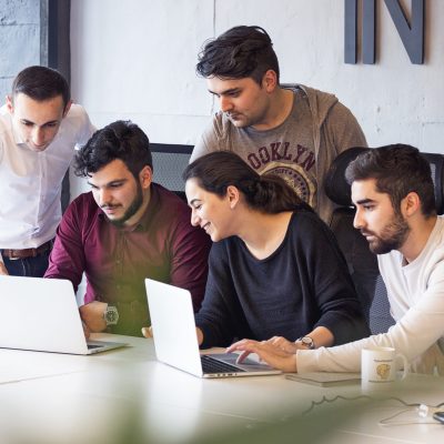 colleagues-working-project-discussing-details